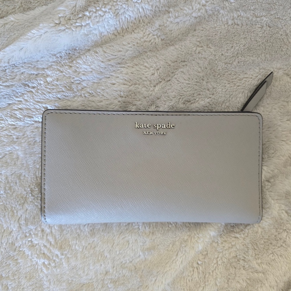 Kate Spade stone gray wallet in like new condition.